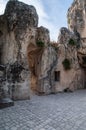 Italy. Matera. Montarrone hill. Natural grotto in the limestone rock. Ruins of a medieval rupestrian monastery