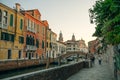 Italy - nov, 2021. The cityscape and architecture of Venice. Urban canal and boats on it
