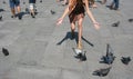 Italy, Piazza San Marco, view of the legs of tourists walking around the square, in the center of the photo of the hand and foot