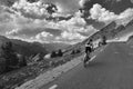 Biker on high mountain pass road Royalty Free Stock Photo