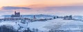 Italy Piedmont: wine yards unique landscape winter sunset, Serralunga d`Alba medieval castle on hill top, the Alps snow capped Royalty Free Stock Photo