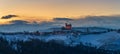 Italy Piedmont: wine yards unique landscape winter sunset, Serralunga d`Alba medieval castle on hill top, the Alps snow capped Royalty Free Stock Photo