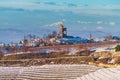 Italy Piedmont: wine yards unique landscape winter sunset, Serralunga d`Alba medieval village castle on hill top, the Alps snow Royalty Free Stock Photo