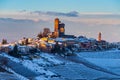 Italy Piedmont: wine yards unique landscape winter sunset, Serralunga d`Alba medieval village castle on hill top, the Alps snow Royalty Free Stock Photo