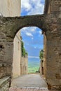 Narrow view of Val d\'Orcia from the archway in Pienza, Italy