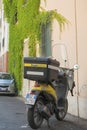 Italy, Pisa - AUGUST 12, 2013: The scooter postman.