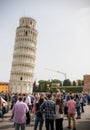 ITALY, PISA 22-04-2019: tourists walking near the leaning tower of Pisa and taking photos