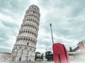 Italy Pisa tower with red suitcase