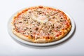 Italy pizza with egg yolk ham mushrooms on a white background Royalty Free Stock Photo