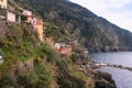 Italy, Riomaggiore Ã¢â¬â 13 April 2019: Side view of awesome village of Riomaggiore, Cinque Terre, Liguria Royalty Free Stock Photo