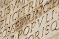 Italy- Rome- Close Up of Latin Words and Letters Carved into a Wall Royalty Free Stock Photo