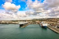 Panoramic view of port of Civitavecchia. Cruise ships, cargo ships and tourist ferries stand in harbor