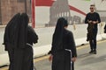 Italy, Rome, October 07, 2018, Nuns in black clothes walking down the street of Rome among tourists