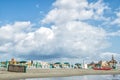 Italy, Rome, Ostia, Tyrrhenian Sea. Beginning / end of the beach season. The coastline is lined with folded umbrellas and sun beds Royalty Free Stock Photo