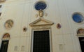 Italy, Rome, Piazza della Minerva, Basilica di Santa Maria Sopra Minerva, door with round stained glass window and coats of arms