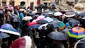 Italy, Rome - September 2016: Crowd with umbrellas is standing near Trevi fountain.