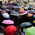 Italy, Rome - September 2016: Crowd with umbrellas is standing near Trevi fountain.