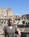 Italy. Rome. The woman tourist on ruins of the ancient Collosseo Royalty Free Stock Photo