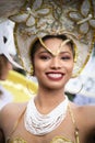 Portrait of a beautiful brazilian dancer in golden and white co