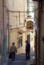 ITALY SANREMO - MAY 5, 2017 two senior men down a alley
