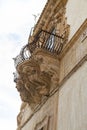 Italy, Sicily, Scicli Ragusa province, the Baroque Beneventano Palace facade, ornamental statues under a balcony