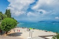 Italy, Sirmione, Lake Garda. July 17, 2014. Beautiful view of the beach of the Italian city of Sirmione on lake Garda from the for