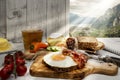 Italy, Torbole, Supper, fried egg and bacon on protein bread Royalty Free Stock Photo