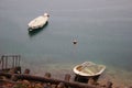 Italy, Trentino: Boats on Ledro lake in a rainy day.