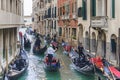 ITALY, VENICE-28 APRIL 2017: Large accumulation of gondolas in the historical center of Venice. Traffic overloaded Royalty Free Stock Photo