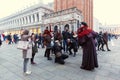Italy; Venice, 24.02.2017. Many people take pictures of a man in Royalty Free Stock Photo