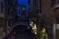 Italy. Venice. Night view of the wonderful traditional Venetian canal with a bridge over it Royalty Free Stock Photo