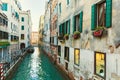 Italy; Venice, 02/25/2017. Street with a bridge, colored, walls