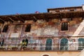 Italy, Verona, old building with a balcony and ancient frescoes