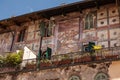 Italy, Verona, old building with a balcony and ancient frescoes