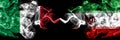 Italy vs Iran, Iranian smoky mystic flags placed side by side. Thick colored silky abstract smoke flags of Italian and Iran,