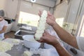 Production of traditional artisanal buffalo cheese mozzarella, in Itanhandu, countryside of Minas Gerais state, Brazil