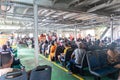 Many passengers sitting inside the Ferry-Boat