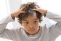 Itchy Scalp from Head Lice of a schoolchild Royalty Free Stock Photo