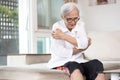 Itchy senior woman scratching arms with her hands,rash on body,pruritus,severe itching of the skin from food allergies,symptoms of