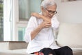 Itchy senior woman is scratching her arm causes of itching from mosquitoes,insect bites or dry itchy skin,old elderly with an