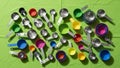 Items include both metallic and colorful plastic cups and spoons varying in Royalty Free Stock Photo