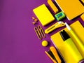 Yellow school supplies arranged on a purple background. Royalty Free Stock Photo