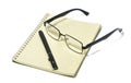 Items for the office, still life, Glasses, modern pair of glasses, black rim, note pad, pen Royalty Free Stock Photo