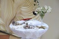 Orthodox cross, crowns for the bride and groom, the Bible, wedding rings on the pillow, candles, a glass of wine, orchids in a vas Royalty Free Stock Photo