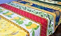Provence style, colorful tablecloths on traditional fabrics decorated with lemons and olives Royalty Free Stock Photo