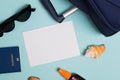 Items for summer vacationl flat lay. Suitcase, passport, sunglasses and empty paper. Royalty Free Stock Photo