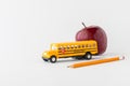 Items to depict a back to school concept, against a white background. Royalty Free Stock Photo