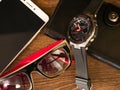 Items of daily use purse watch glasses mobile phone