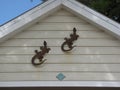 Wrought iron lizards decorate the gabled end of a historic Key West Florida House. Royalty Free Stock Photo