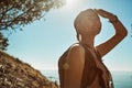 Its absolutely breathtaking up here. a young woman admiring the view from the top of a mountain. Royalty Free Stock Photo